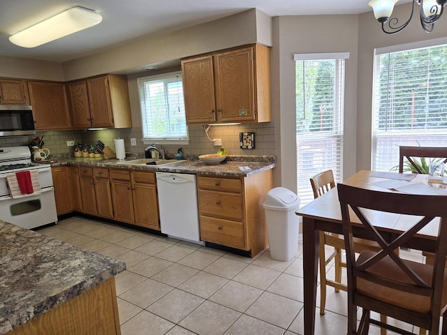 997 W Briarcliff Rd, Bolingbrook, IL 60440 - kitchen featuring white appliances, backsplash, light tile patterned floors, and healthy amount of natural light