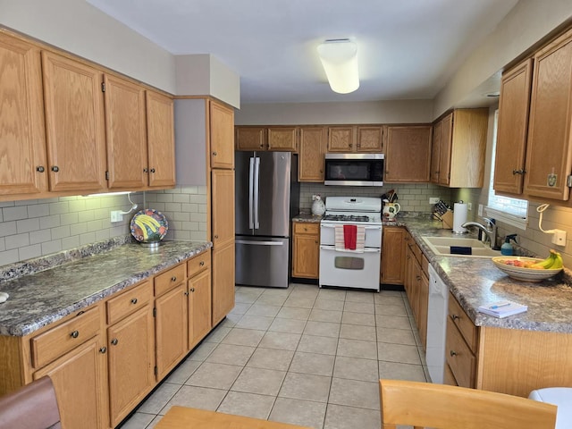 997 W Briarcliff Rd, Bolingbrook, IL 60440 - kitchen with stainless steel appliances, decorative backsplash, light tile patterned flooring, and brown cabinets
