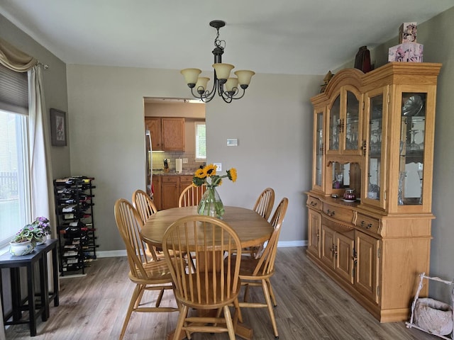 997 W Briarcliff Rd, Bolingbrook, IL 60440 - dining area featuring wood finished floors and a chandelier
