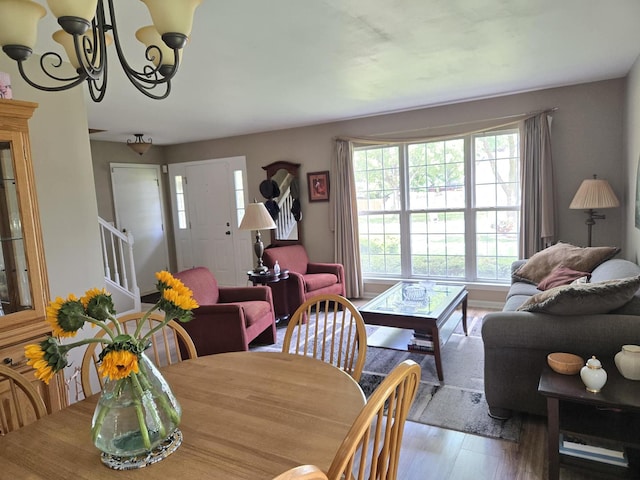 997 W Briarcliff Rd, Bolingbrook, IL 60440 - dining room with stairway, a chandelier, and wood finished floors