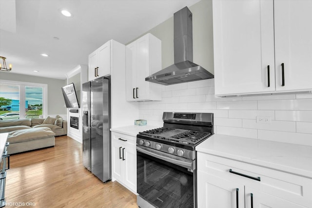 7218 S 78th Ave, Bridgeview, IL 60455 - kitchen with stainless steel appliances, wall chimney range hood, light countertops, open floor plan, and recessed lighting