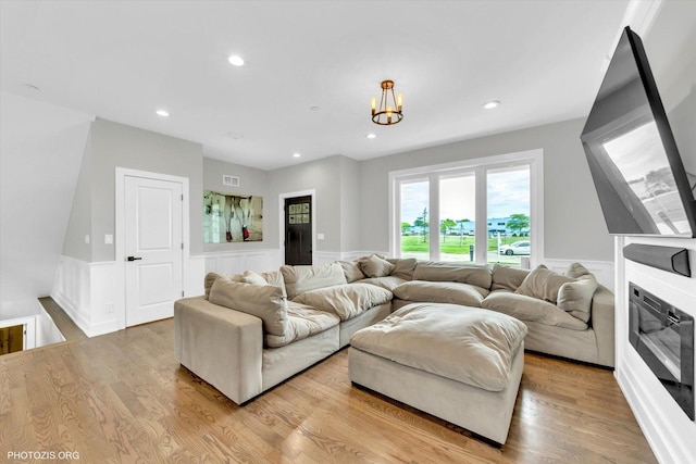 7218 S 78th Ave, Bridgeview, IL 60455 - living area featuring a wainscoted wall, light wood-style floors, recessed lighting, a decorative wall, and a chandelier