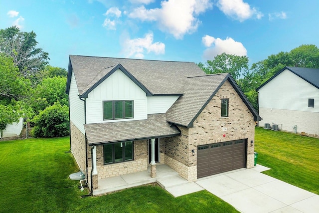 7218 S 78th Ave, Bridgeview, IL 60455 - view of front facade featuring board and batten siding, concrete driveway, a front lawn, and a shingled roof