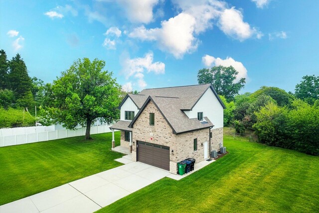 7218 S 78th Ave, Bridgeview, IL 60455 - view of front of house with an attached garage, concrete driveway, stone siding, central AC unit, and a shingled roof