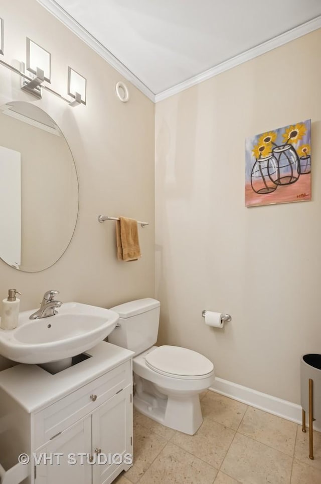 201 N Westshore Dr Unit 2608, Chicago, IL 60601 - half bath featuring crown molding, toilet, vanity, baseboards, and tile patterned floors