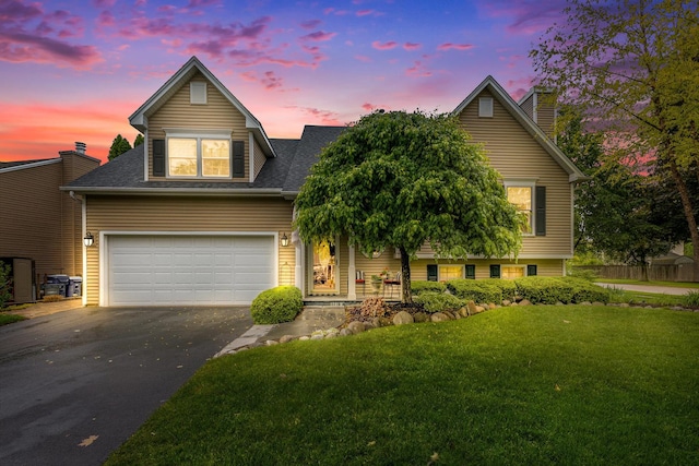 1714 Larson Ave, Saint Charles, IL 60174 - view of front facade featuring driveway, a yard, a garage, a chimney, and a shingled roof