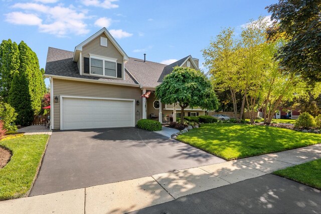 1714 Larson Ave, Saint Charles, IL 60174 - view of front of house with driveway, a front yard, roof with shingles, and a garage