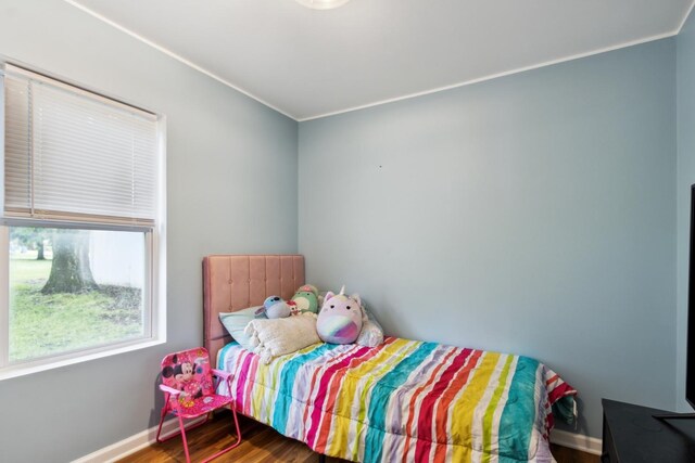 1818 W 9th St, Dixon, IL 61021 - bedroom featuring wood finished floors, ornamental molding, and baseboards