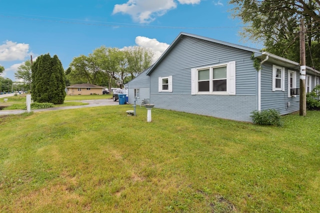1818 W 9th St, Dixon, IL 61021 - view of side of property featuring a yard and brick siding