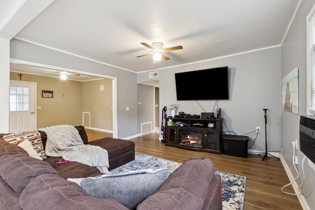 1818 W 9th St, Dixon, IL 61021 - living room featuring ceiling fan, wood finished floors, and baseboards