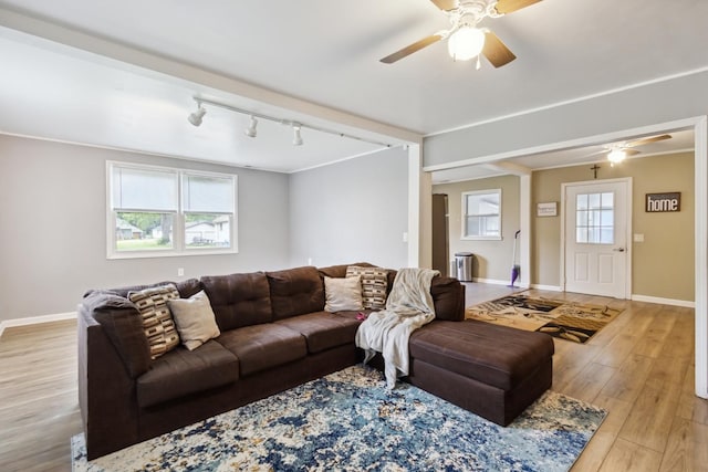 1818 W 9th St, Dixon, IL 61021 - living area featuring ceiling fan, wood finished floors, and baseboards