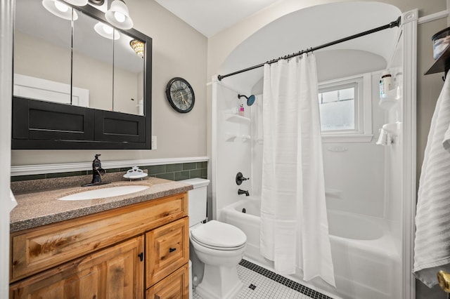 216 S Genoa St, Genoa, IL 60135 - bathroom with tile patterned floors, shower / bath combo with shower curtain, toilet, vanity, and tile walls