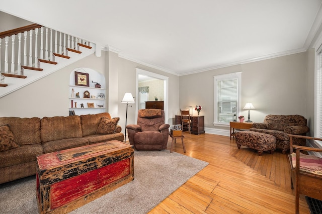 216 S Genoa St, Genoa, IL 60135 - living area with crown molding, stairs, wood finished floors, and baseboards