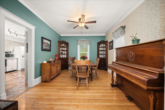 216 S Genoa St, Genoa, IL 60135 - dining area with ceiling fan, ornamental molding, baseboards, and light wood finished floors