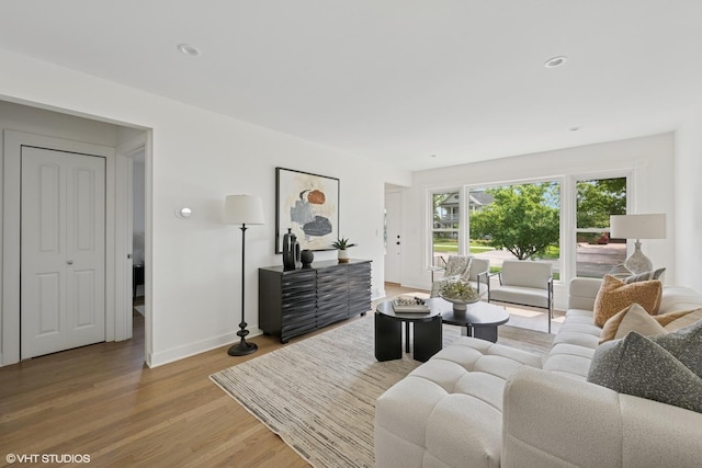 1208 N Dunton Ave, Arlington Heights, IL 60004 - living room with light wood-style floors, baseboards, and recessed lighting
