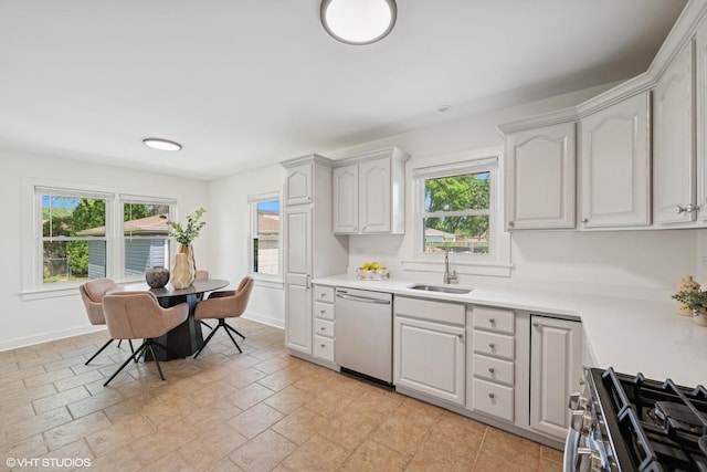 1208 N Dunton Ave, Arlington Heights, IL 60004 - kitchen with appliances with stainless steel finishes, a sink, light countertops, and white cabinetry