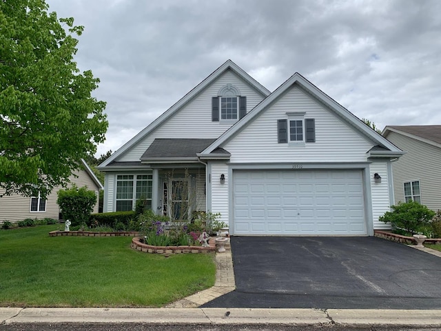 39510 N Cambridge Blvd, Beach Park, IL 60083 - traditional home with asphalt driveway, a front yard, and a garage