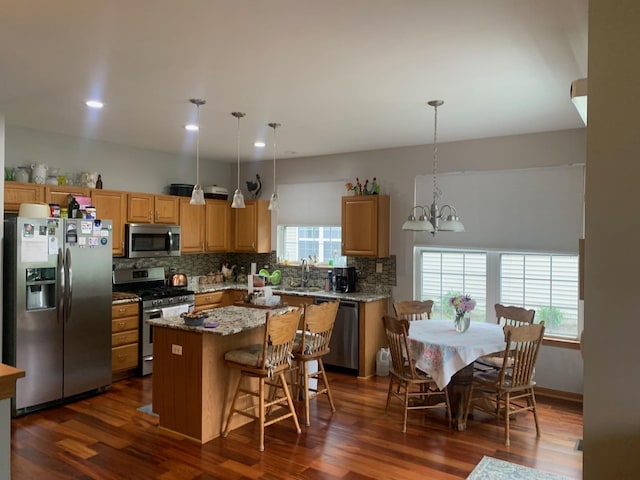39510 N Cambridge Blvd, Beach Park, IL 60083 - kitchen featuring stainless steel appliances, a kitchen island, decorative backsplash, dark wood-type flooring, and recessed lighting
