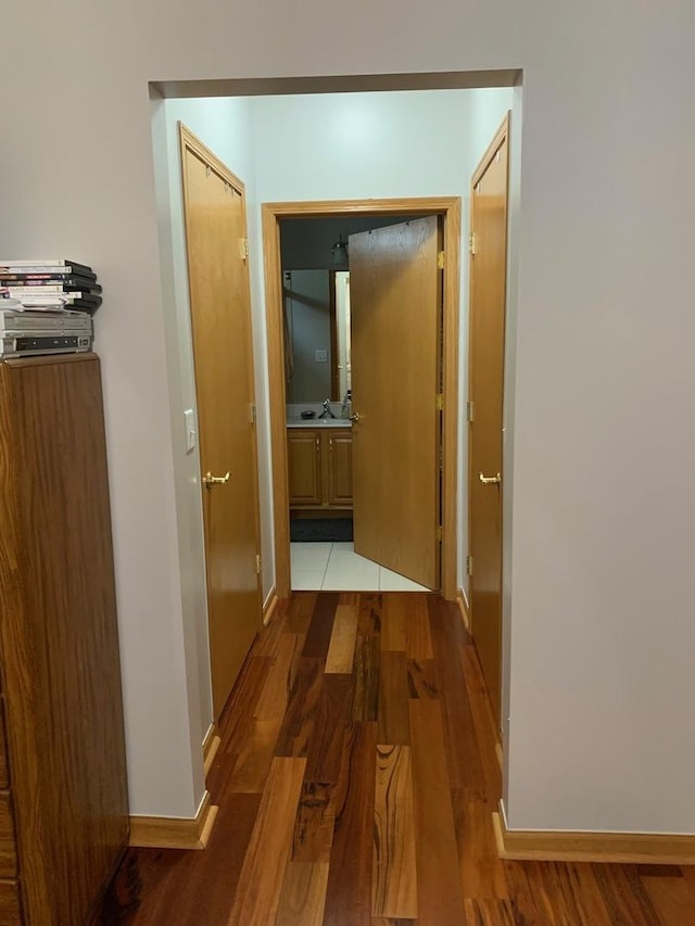 39510 N Cambridge Blvd, Beach Park, IL 60083 - hallway with wood finished floors, baseboards, and a sink