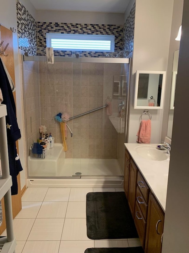 39510 N Cambridge Blvd, Beach Park, IL 60083 - bathroom featuring tile patterned floors, a shower stall, and vanity