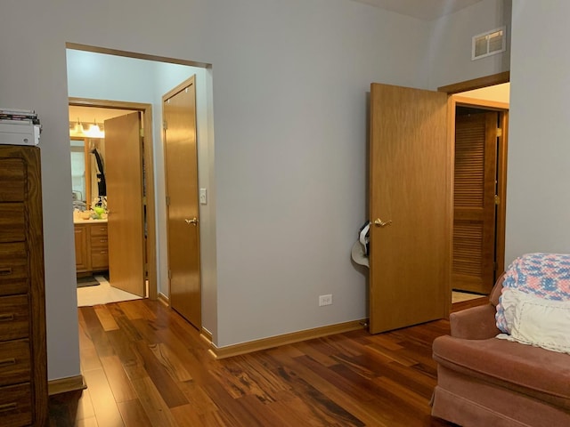 39510 N Cambridge Blvd, Beach Park, IL 60083 - bedroom with wood finished floors, baseboards, and ensuite bathroom