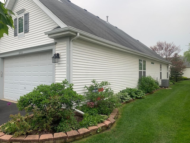 39510 N Cambridge Blvd, Beach Park, IL 60083 - view of home's exterior featuring a garage, a yard, and a shingled roof