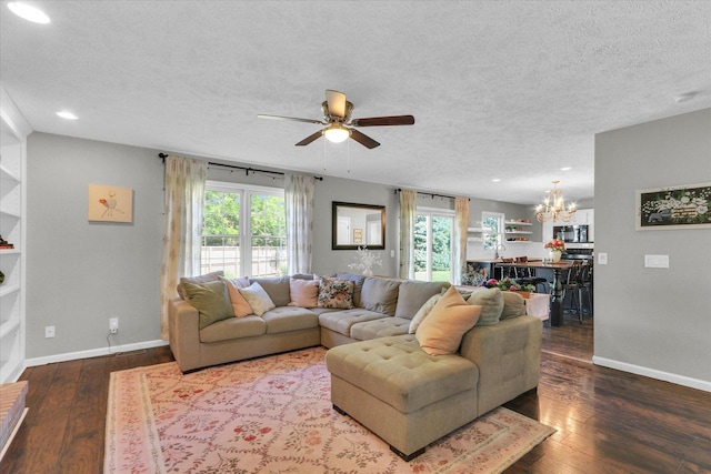 1517 Bridge Point Ln, Champaign, IL 61822 - living area featuring a textured ceiling, a chandelier, wood finished floors, a ceiling fan, and baseboards