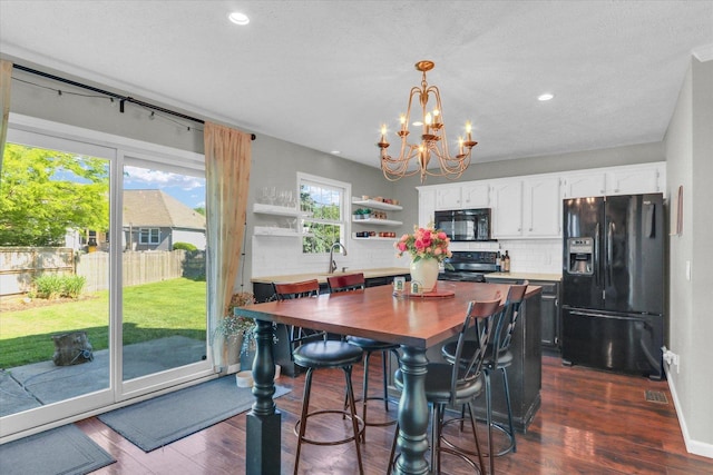 1517 Bridge Point Ln, Champaign, IL 61822 - dining area with a chandelier, dark wood-style flooring, and recessed lighting