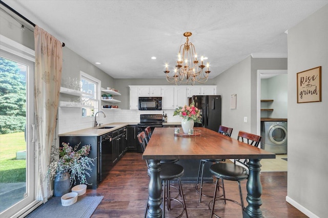 1517 Bridge Point Ln, Champaign, IL 61822 - dining area with washer / clothes dryer, dark wood-style flooring, a chandelier, a textured ceiling, and recessed lighting