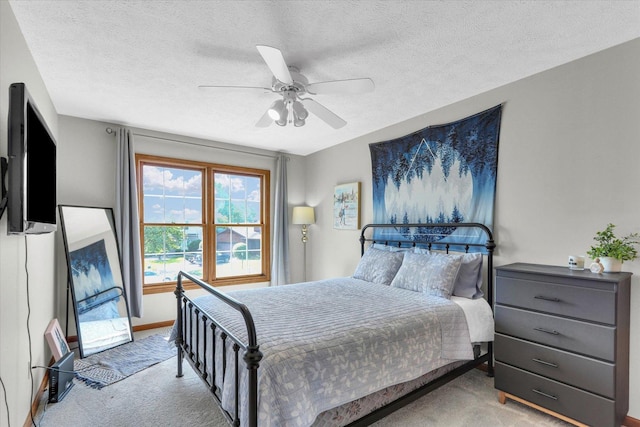 1517 Bridge Point Ln, Champaign, IL 61822 - carpeted bedroom with ceiling fan, a textured ceiling, and baseboards
