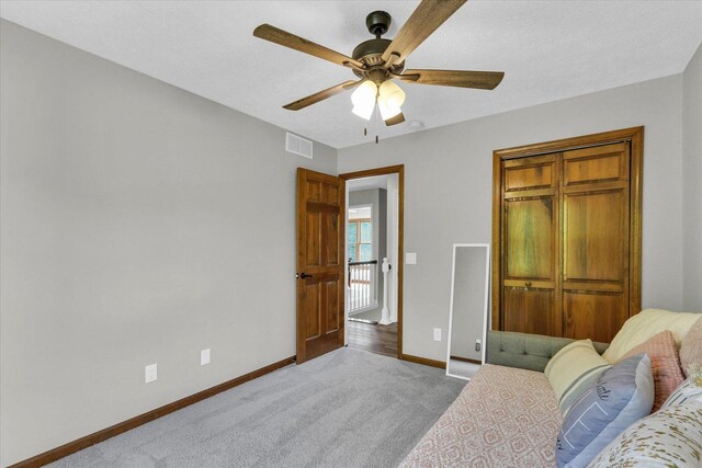 1517 Bridge Point Ln, Champaign, IL 61822 - carpeted bedroom with baseboards, ceiling fan, and a closet