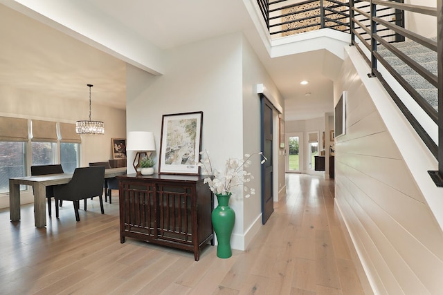 244 Kenmore Ave, Deerfield, IL 60015 - hallway with a chandelier, light wood-style floors, stairs, recessed lighting, and baseboards