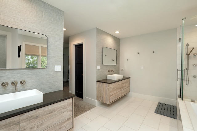 244 Kenmore Ave, Deerfield, IL 60015 - bathroom with a tile shower, two vanities, decorative backsplash, baseboards, and recessed lighting