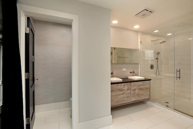 244 Kenmore Ave, Deerfield, IL 60015 - bathroom with double vanity, a shower stall, toilet, recessed lighting, and tile patterned flooring