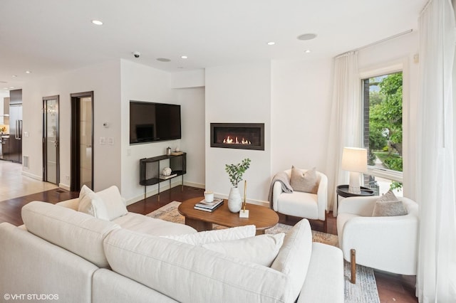 3635 N Paulina St, Chicago, IL 60613 - living room featuring a glass covered fireplace, light wood finished floors, recessed lighting, and baseboards