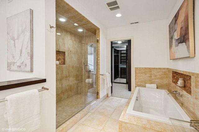 3635 N Paulina St, Chicago, IL 60613 - full bathroom featuring a shower stall, a bath, tile patterned flooring, recessed lighting, and a spacious closet
