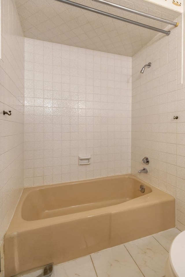 410 W Kirchhoff Rd, Arlington Heights, IL 60005 - bathroom with toilet, marble look tile flooring, and washtub / shower combination
