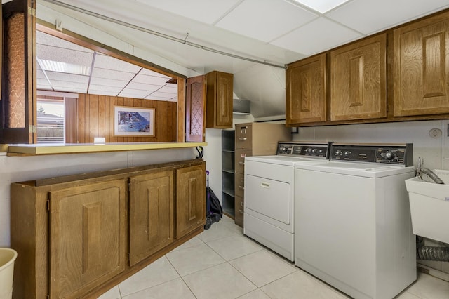 410 W Kirchhoff Rd, Arlington Heights, IL 60005 - washroom featuring cabinet space, separate washer and dryer, and light tile patterned flooring