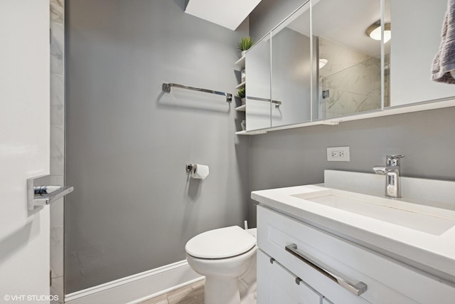 340 W Diversey Pkwy Unit 1020, Chicago, IL 60657 - bathroom featuring vanity, toilet, tiled shower, and baseboards