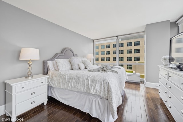 340 W Diversey Pkwy Unit 1020, Chicago, IL 60657 - bedroom with dark wood-type flooring and baseboards