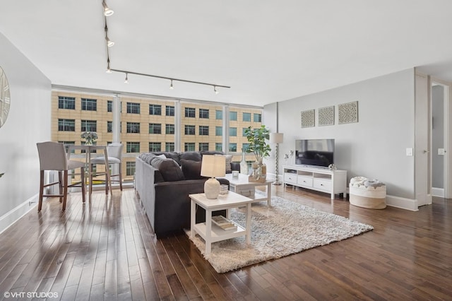 340 W Diversey Pkwy Unit 1020, Chicago, IL 60657 - living room with rail lighting, baseboards, and dark wood-type flooring