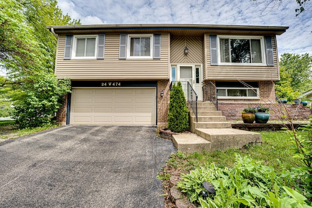24W474 Surf Ct, Naperville, IL 60540 - bi-level home with an attached garage, asphalt driveway, and brick siding
