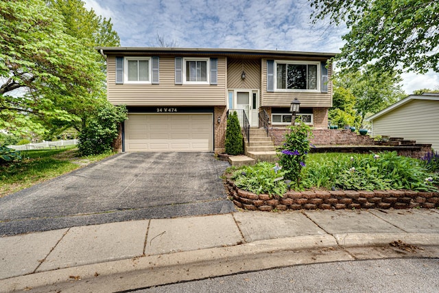24W474 Surf Ct, Naperville, IL 60540 - split foyer home featuring asphalt driveway, a garage, and brick siding