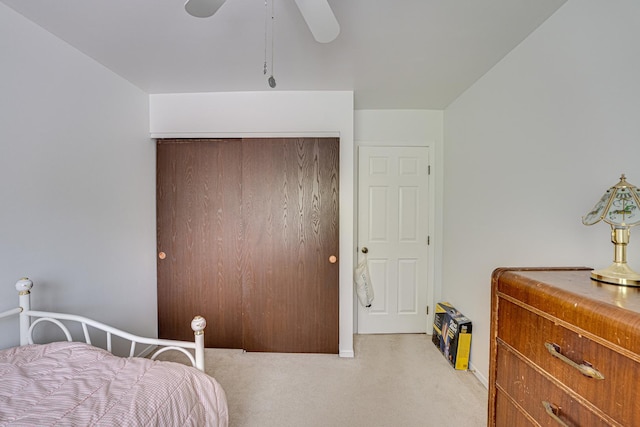 24W474 Surf Ct, Naperville, IL 60540 - bedroom with light carpet, a closet, and a ceiling fan