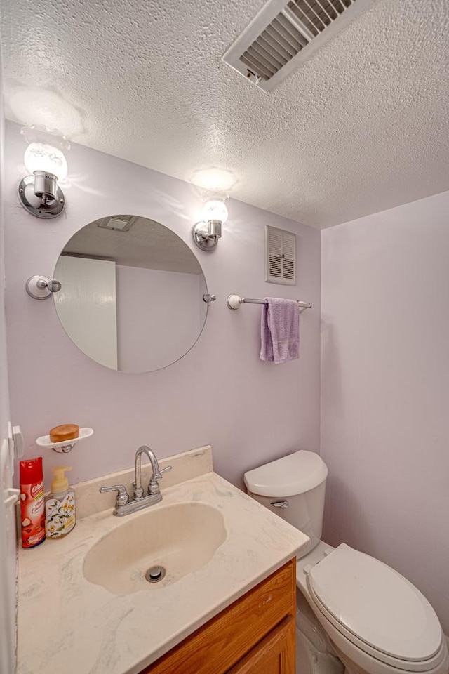 24W474 Surf Ct, Naperville, IL 60540 - bathroom with a textured ceiling, vanity, and toilet