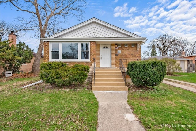 18371 Gladville Ave, Homewood, IL 60430 - bungalow-style home with brick siding and a front lawn