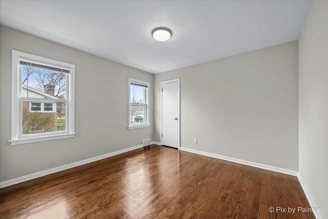 18371 Gladville Ave, Homewood, IL 60430 - unfurnished room featuring dark wood-style flooring and baseboards