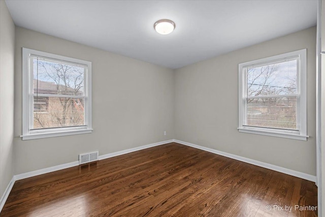 18371 Gladville Ave, Homewood, IL 60430 - unfurnished room featuring dark wood-type flooring and baseboards