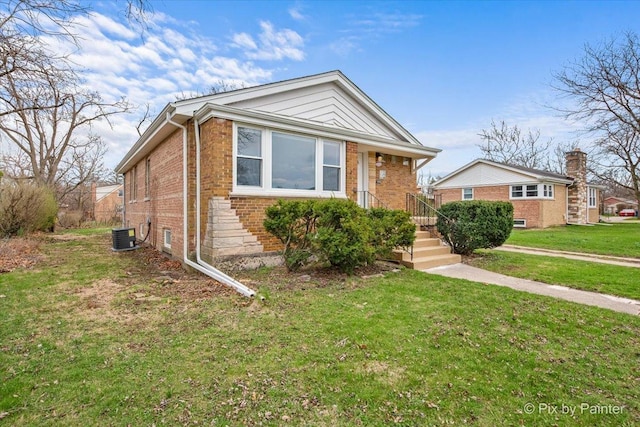 18371 Gladville Ave, Homewood, IL 60430 - bungalow-style house with brick siding, a front yard, and cooling unit