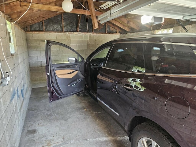 18371 Gladville Ave, Homewood, IL 60430 - garage featuring a garage door opener and concrete block wall